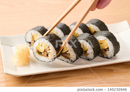 Thick sushi rolls served on a plate Thick sushi rolls served on a plate 140230946