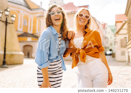 Street photo of beautiful women enjoying a weekend, traveling. Travel, adventure concept. Street photo of beautiful women enjoying a weekend, traveling. Travel, adventure concept. 140231278