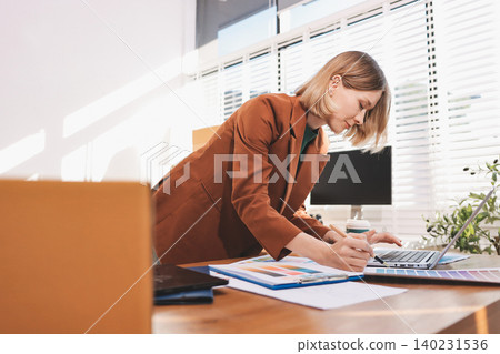 Fashion designer woman and typing on laptop in shop for email project or online order of fabric in creative startup Serious tailor computer and small business for clothes or textile in : Generative AI Fashion designer woman and typing on laptop in shop for email project or online order of fabric in creative startup Serious tailor computer and small business for clothes or textile in : Generative AI 140231536