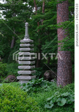 The Japanese garden and stone pagoda in Omiya Park, surrounded by the greenery of early summer. The Japanese garden and stone pagoda in Omiya Park, surrounded by the greenery of early summer. 140231610