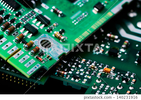 Electronic circuit board. Semiconductor motherboard circuit board technology. Mainboard of computer. Integrated semiconductor microchip on green circuit board. Hi-tech industry and computer science. Electronic circuit board. Semiconductor motherboard circuit board technology. Mainboard of computer. Integrated semiconductor microchip on green circuit board. Hi-tech industry and computer science. 140231916