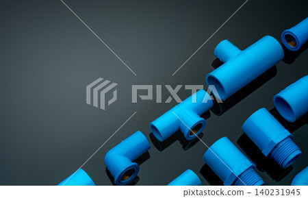Set of blue PVC pipe fittings isolated on dark background. Blue plastic water pipe. PVC accessories for plumbing. Plumber equipment. Bend and three way connection plastic pipe for water drain sewage. Set of blue PVC pipe fittings isolated on dark background. Blue plastic water pipe. PVC accessories for plumbing. Plumber equipment. Bend and three way connection plastic pipe for water drain sewage. 140231945