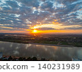 Sunset Reflections Over Agricultural Plains by the Mekong River 140231989