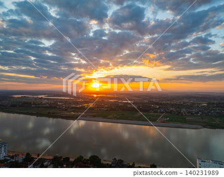Sunset Reflections Over Agricultural Plains by the Mekong River Sunset Reflections Over Agricultural Plains by the Mekong River 140231989