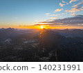 Sunset Colors Flowing Across Endless Mountain Layers 140231991