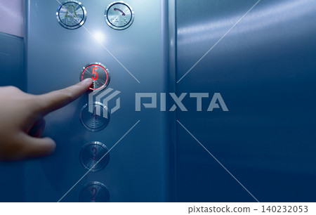 Person pressing on the fifth floor of elevator button. Hand press number 5 on button inside office or hotel lift. Index finger press on lift button. Claustrophobia. People stuck in lift. Braille code. 140232053