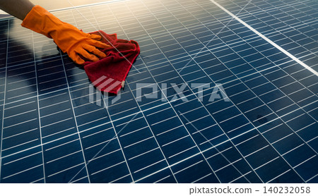 Man cleaning solar panel on roof. Solar panel or photovoltaic module maintenance. Sustainable resource and renewable energy for go green concept.  Solar power for green energy. Technology for future. 140232058