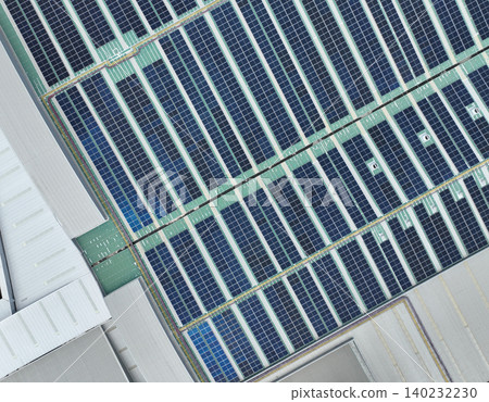 Solar energy system installed on the rooftop of an industrial factory and warehouse. Clean and renewable power solutions, green energy innovation, and sustainable commercial electricity generation. Solar energy system installed on the rooftop of an industrial factory and warehouse. Clean and renewable power solutions, green energy innovation, and sustainable commercial electricity generation. 140232230