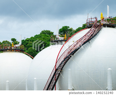 Industrial gas storage tank in factory, LNG or liquefied natural gas container in petroleum refinery. Energy industry infrastructure for natural gas storage. Global energy supply. Fuel reservoir. Industrial gas storage tank in factory, LNG or liquefied natural gas container in petroleum refinery. Energy industry infrastructure for natural gas storage. Global energy supply. Fuel reservoir. 140232240