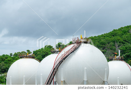 Industrial gas storage tank in factory, LNG or liquefied natural gas container in petroleum refinery. Energy industry infrastructure for natural gas storage. Global energy supply. Fuel reservoir. 140232241