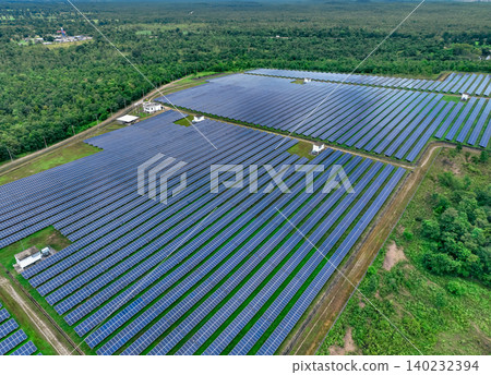 Aerial view of solar farm. Sustainable renewable energy and modern photovoltaic technology for eco-friendly electricity production. Solar power station. Green energy solutions. Solar panel technology. Aerial view of solar farm. Sustainable renewable energy and modern photovoltaic technology for eco-friendly electricity production. Solar power station. Green energy solutions. Solar panel technology. 140232394