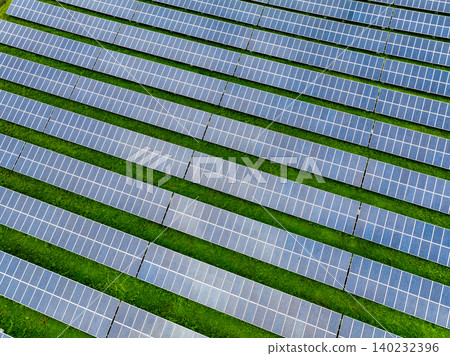 Aerial view of solar farm. Sustainable renewable energy and modern photovoltaic technology for eco-friendly electricity production. Solar power station. Green energy solutions. Solar panel technology. Aerial view of solar farm. Sustainable renewable energy and modern photovoltaic technology for eco-friendly electricity production. Solar power station. Green energy solutions. Solar panel technology. 140232396