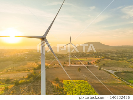 Wind farm field and sunset sky. Wind power. Sustainable, renewable energy. Wind turbines generate electricity. Sustainable development. Green technology for energy sustainability. Eco-friendly energy. Wind farm field and sunset sky. Wind power. Sustainable, renewable energy. Wind turbines generate electricity. Sustainable development. Green technology for energy sustainability. Eco-friendly energy. 140232436