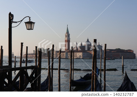 Italy, Venice Old Town, San Giorgio Maggiore Island as seen from the San Marco district in the early morning. Italy, Venice Old Town, San Giorgio Maggiore Island as seen from the San Marco district in the early morning. 140232787