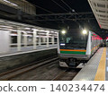 A train passing by on the platform at night 140234474