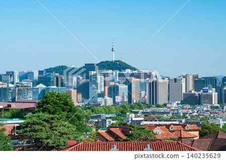 Seoul, South Korea - June. 05, 2026 : Scenic view of Namsan Seoul Tower towering over downtown skyscrapers on a clear summer day in Seoul, South Korea Seoul, South Korea - June. 05, 2026 : Scenic view of Namsan Seoul Tower towering over downtown skyscrapers on a clear summer day in Seoul, South Korea 140235629