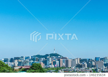 Seoul, South Korea - June. 05, 2026 : Scenic view of Namsan Seoul Tower towering over downtown skyscrapers on a clear summer day in Seoul, South Korea Seoul, South Korea - June. 05, 2026 : Scenic view of Namsan Seoul Tower towering over downtown skyscrapers on a clear summer day in Seoul, South Korea 140235634