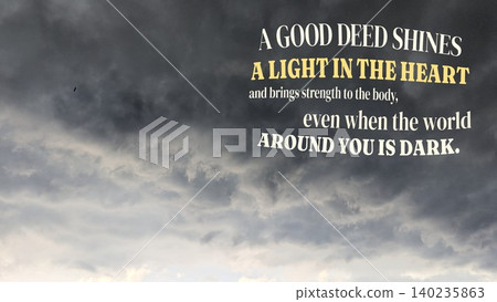 Inspirational typography layout features motivational quote text, a good deed shines a light in the heart brings strength to the body even when the world around you is dark, on dark dramatic storm 140235863