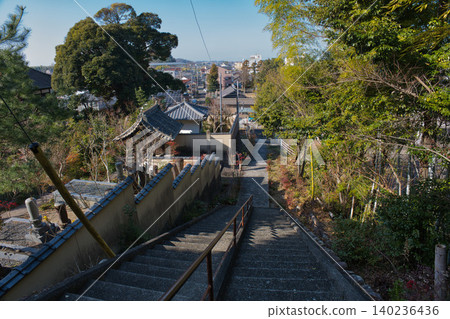 A distant view of a retro Japanese staircase and streetscape that retains a nostalgic atmosphere. A distant view of a retro Japanese staircase and streetscape that retains a nostalgic atmosphere. 140236436