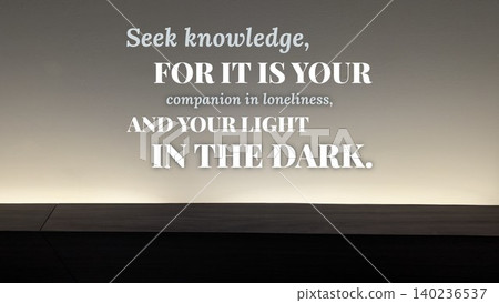 Inspirational typography design featuring the quote Seek Knowledge, for it is your companion in loneliness, your light in the dark. Horizontal poster uses bold white, yellow text set against a Inspirational typography design featuring the quote Seek Knowledge, for it is your companion in loneliness, your light in the dark. Horizontal poster uses bold white, yellow text set against a 140236537