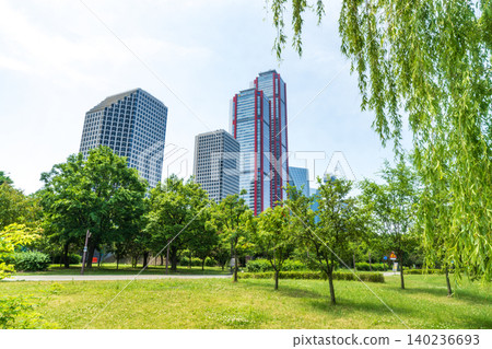 Seoul, South Korea - May. 24, 2026 : Scenic view of Yeouido financial district skyscrapers framed by lush green trees at Yeouido Park in Seoul, South Korea Seoul, South Korea - May. 24, 2026 : Scenic view of Yeouido financial district skyscrapers framed by lush green trees at Yeouido Park in Seoul, South Korea 140236693