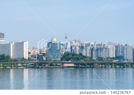 Seoul, South Korea - May. 24, 2026 : The Han River bus (river bus) cruising on the Han River with Namsan Seoul Tower and cityscape in the background on a clear spring afternoon 140236767