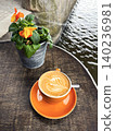Cups of Hot Cappuccino Coffee in a Cafeteria on the River Bank. Cups of Hot Cappuccino Coffee in a Cafeteria on the River Bank. 140236981