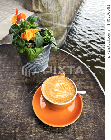 Cups of Hot Cappuccino Coffee in a Cafeteria on the River Bank. 140236981