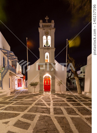 Church with bell tower in Mykonos, Greece at night 140237596