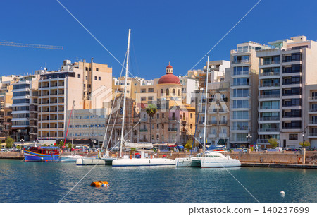 Sliema waterfront with marina yachts and church dome in Malta 140237699