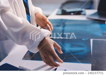 Medical Team Meeting, Doctors Taking Notes During Briefing Session Medical Team Meeting, Doctors Taking Notes During Briefing Session 140237731