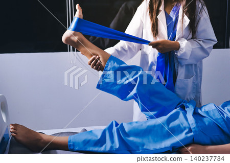 Doctor checks Asian senior woman patient after knee replacement operation in hospital room. Nurse examines leg after surgery. Medicine health treatment therapy healthcare concept Doctor checks Asian senior woman patient after knee replacement operation in hospital room. Nurse examines leg after surgery. Medicine health treatment therapy healthcare concept 140237784