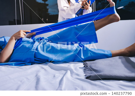 Doctor checks Asian senior woman patient after knee replacement operation in hospital room. Nurse examines leg after surgery. Medicine health treatment therapy healthcare concept Doctor checks Asian senior woman patient after knee replacement operation in hospital room. Nurse examines leg after surgery. Medicine health treatment therapy healthcare concept 140237790