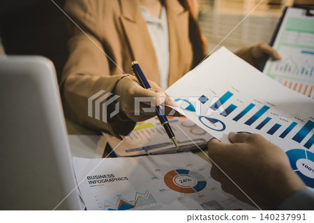 Business accounting concept, Business man using calculator with computer laptop, budget and loan paper in office. Business accounting concept, Business man using calculator with computer laptop, budget and loan paper in office. 140237991