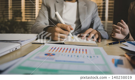 Business accounting concept, Business man using calculator with computer laptop, budget and loan paper in office. Business accounting concept, Business man using calculator with computer laptop, budget and loan paper in office. 140238019