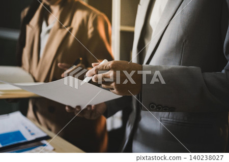 Business accounting concept, Business man using calculator with computer laptop, budget and loan paper in office. Business accounting concept, Business man using calculator with computer laptop, budget and loan paper in office. 140238027