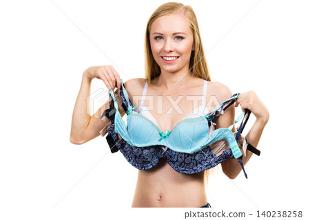 Female holds bras. Bra fitting Female holds bras. Bra fitting 140238258