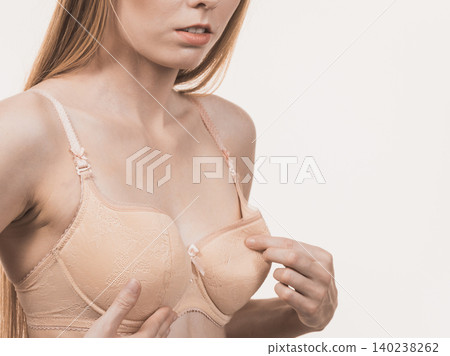 Girl wearing too big bra cup Girl wearing too big bra cup 140238262