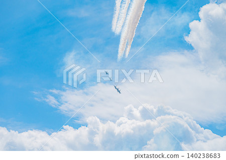Blue Impulse aerobatic team flying in formation against a clear blue sky at Kamifurano Garrison. Blue Impulse aerobatic team flying in formation against a clear blue sky at Kamifurano Garrison. 140238683