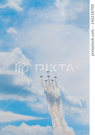 Blue Impulse aerobatic team flying in formation against a clear blue sky at Kamifurano Garrison. Blue Impulse aerobatic team flying in formation against a clear blue sky at Kamifurano Garrison. 140238709
