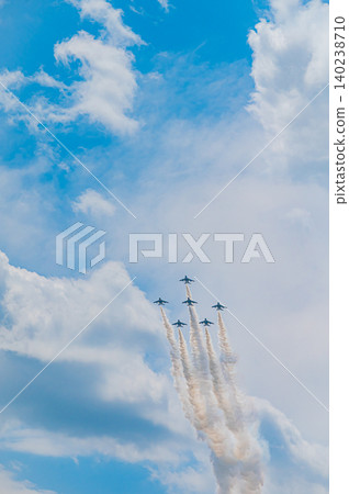 Blue Impulse aerobatic team flying in formation against a clear blue sky at Kamifurano Garrison. Blue Impulse aerobatic team flying in formation against a clear blue sky at Kamifurano Garrison. 140238710