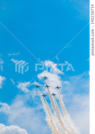 Blue Impulse aerobatic team flying in formation against a clear blue sky at Kamifurano Garrison. Blue Impulse aerobatic team flying in formation against a clear blue sky at Kamifurano Garrison. 140238714