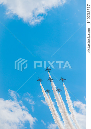 Blue Impulse aerobatic team flying in formation against a clear blue sky at Kamifurano Garrison. 140238717