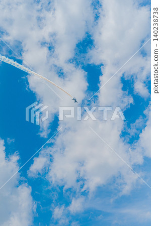 Blue Impulse aerobatic team flying in formation against a clear blue sky at Kamifurano Garrison. Blue Impulse aerobatic team flying in formation against a clear blue sky at Kamifurano Garrison. 140238738