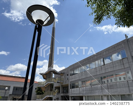 White buildings under white clouds and a blue sky 140238775