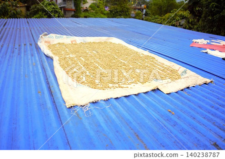 A scene of clothes drying on rooftops in a village in the Annapurna Mountains, Nepal. A scene of clothes drying on rooftops in a village in the Annapurna Mountains, Nepal. 140238787