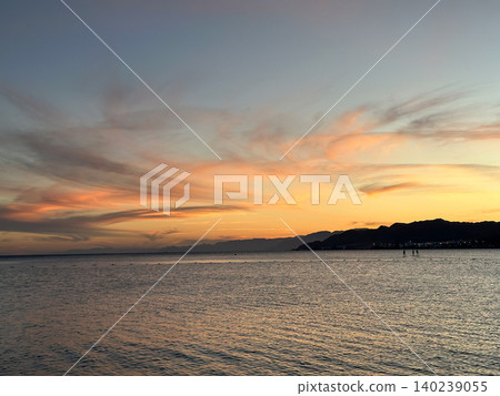 Athletes on SAP boards in Eilat on background of sunset Athletes on SAP boards in Eilat on background of sunset 140239055