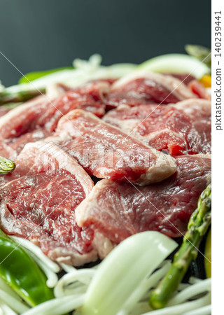 Hokkaido's specialty, Jingisukan: Lamb and vegetables are grilled in a special pan. Hokkaido's specialty, Jingisukan: Lamb and vegetables are grilled in a special pan. 140239441
