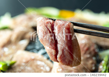 Hokkaido's specialty, Jingisukan: Lamb and vegetables are grilled in a special pan. Hokkaido's specialty, Jingisukan: Lamb and vegetables are grilled in a special pan. 140239442