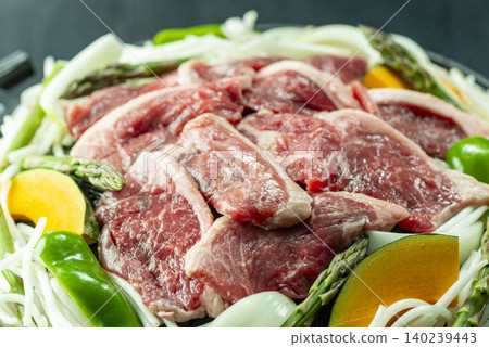 Hokkaido's specialty, Jingisukan: Lamb and vegetables are grilled in a special pan. Hokkaido's specialty, Jingisukan: Lamb and vegetables are grilled in a special pan. 140239443